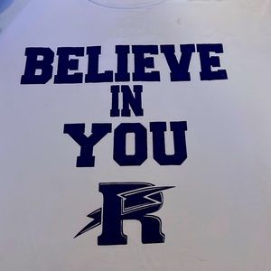 White shite with the saying “believe in you “